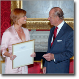 Caroline receives the Outstanding Contribution to Radio and Journalism Award from Prince Phillip